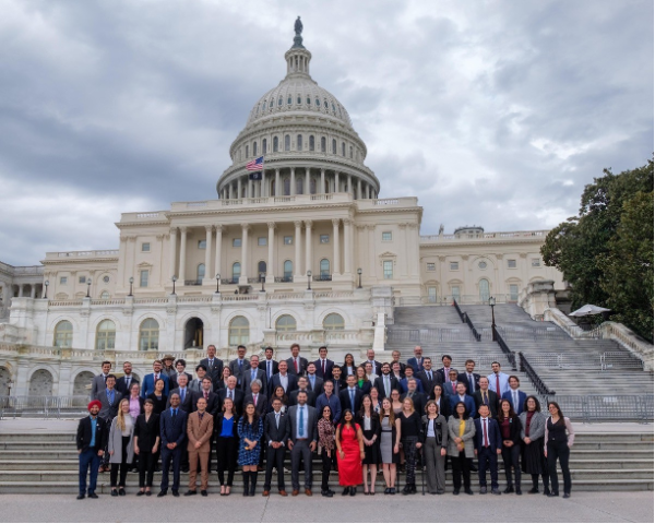 DC trip members pose in front of the capital.